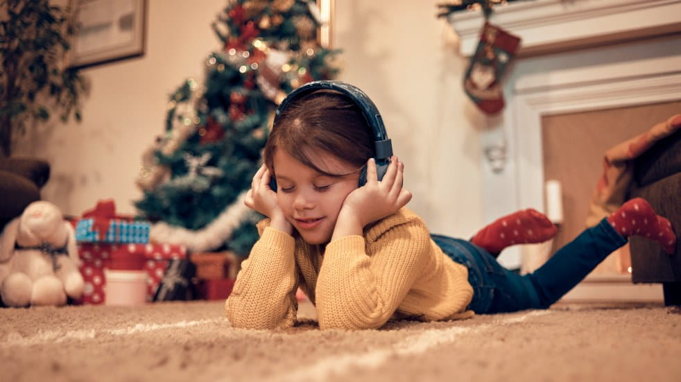girl listening to music on headphones
